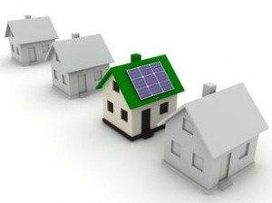A row of houses with solar panels on the roof.